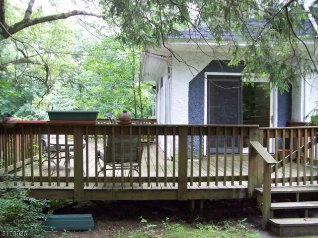 a wooden deck with lake view