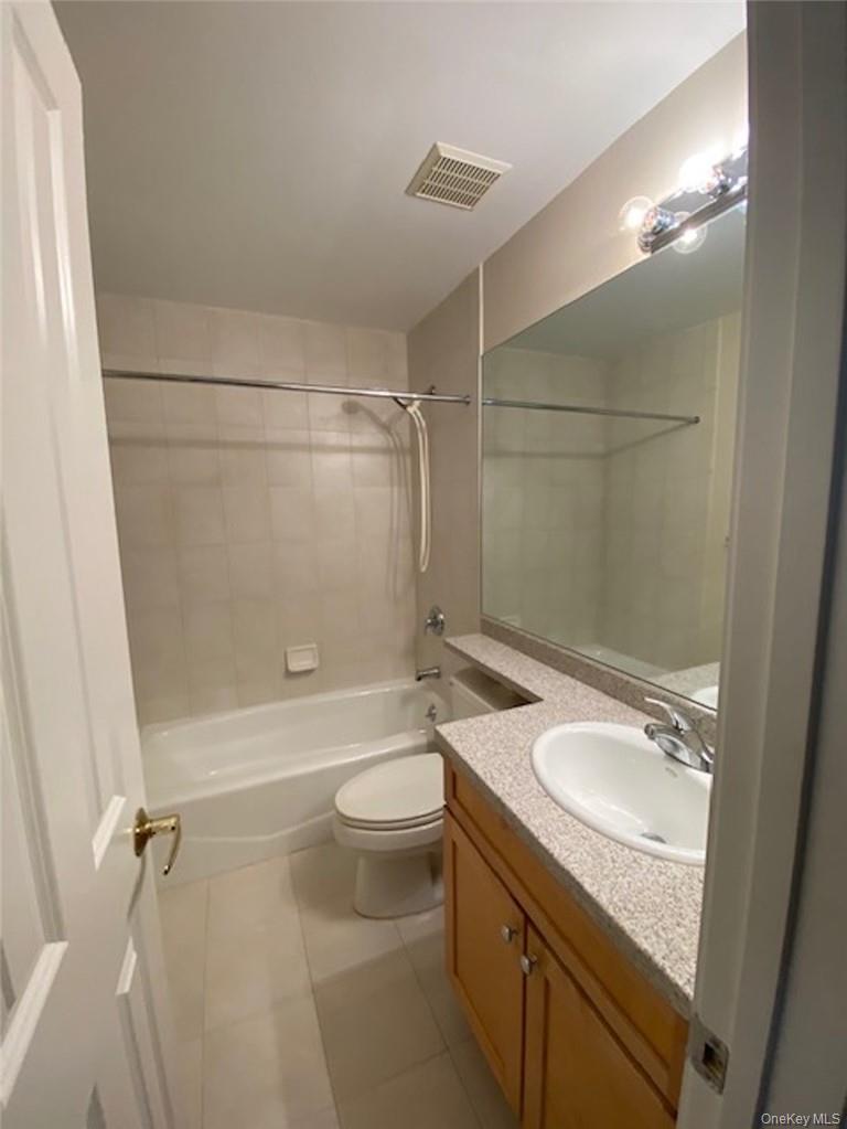 51 Winding Ridge Road White Plains, NY 10603 - Photo 14 of 30 a bathroom with a granite countertop sink toilet and shower