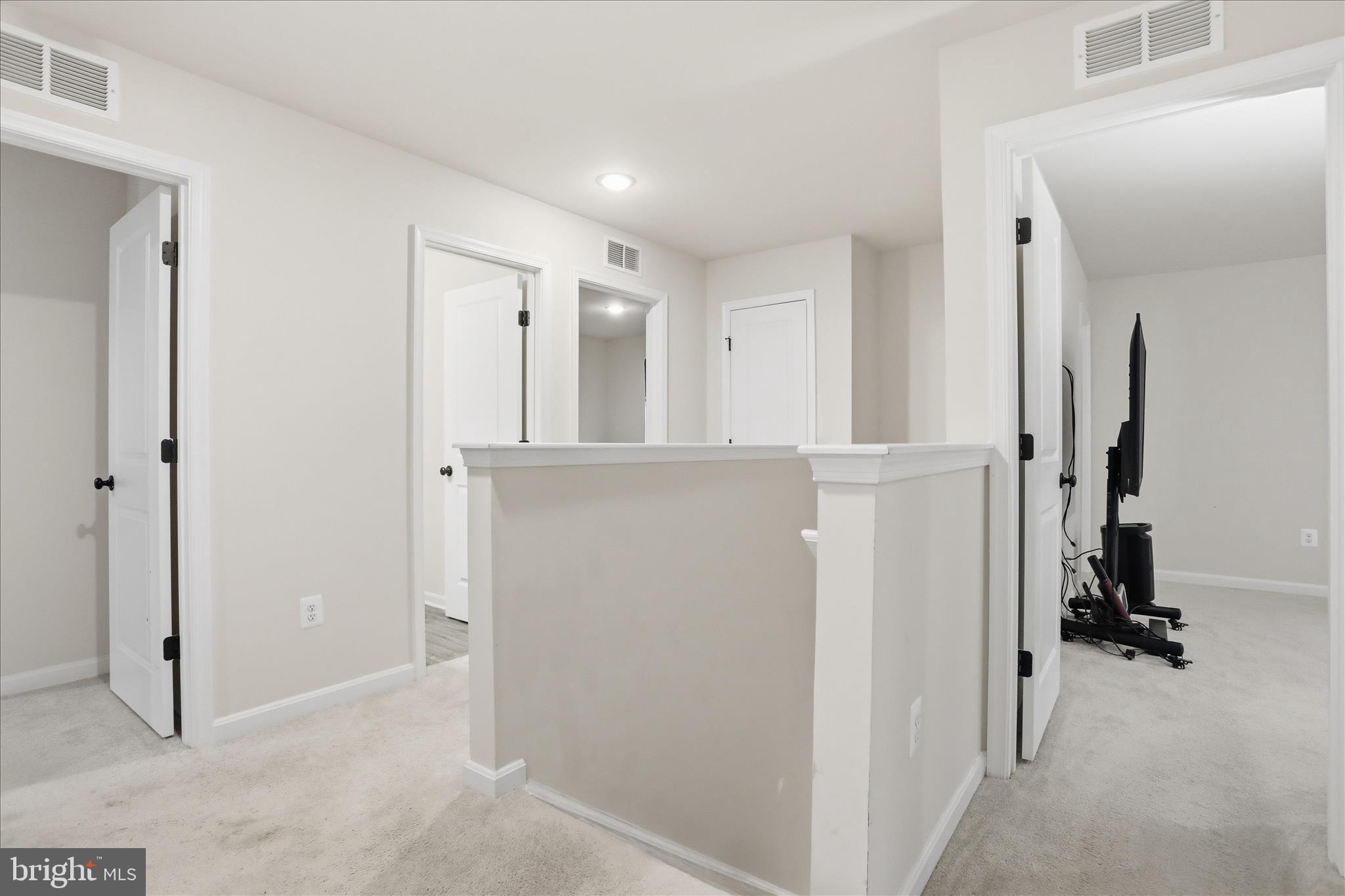76 Diving Scaup Road Hedgesville, WV 25427 - Photo 16 of 48 hallway with wooden floor and closet