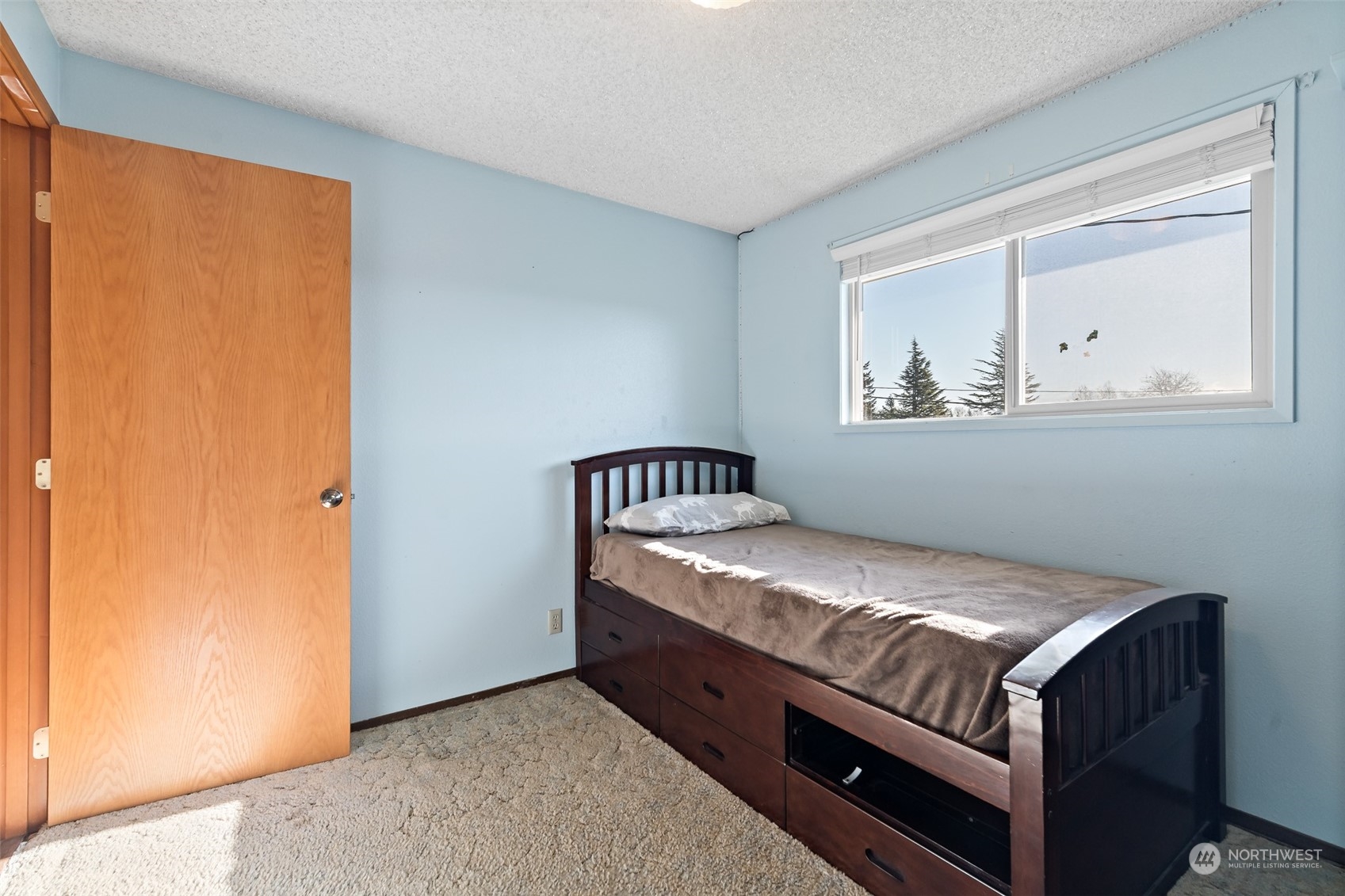 2180 Brown Road Ferndale, WA 98248 - Photo 13 of 40 a bed sitting in a bedroom next to a window