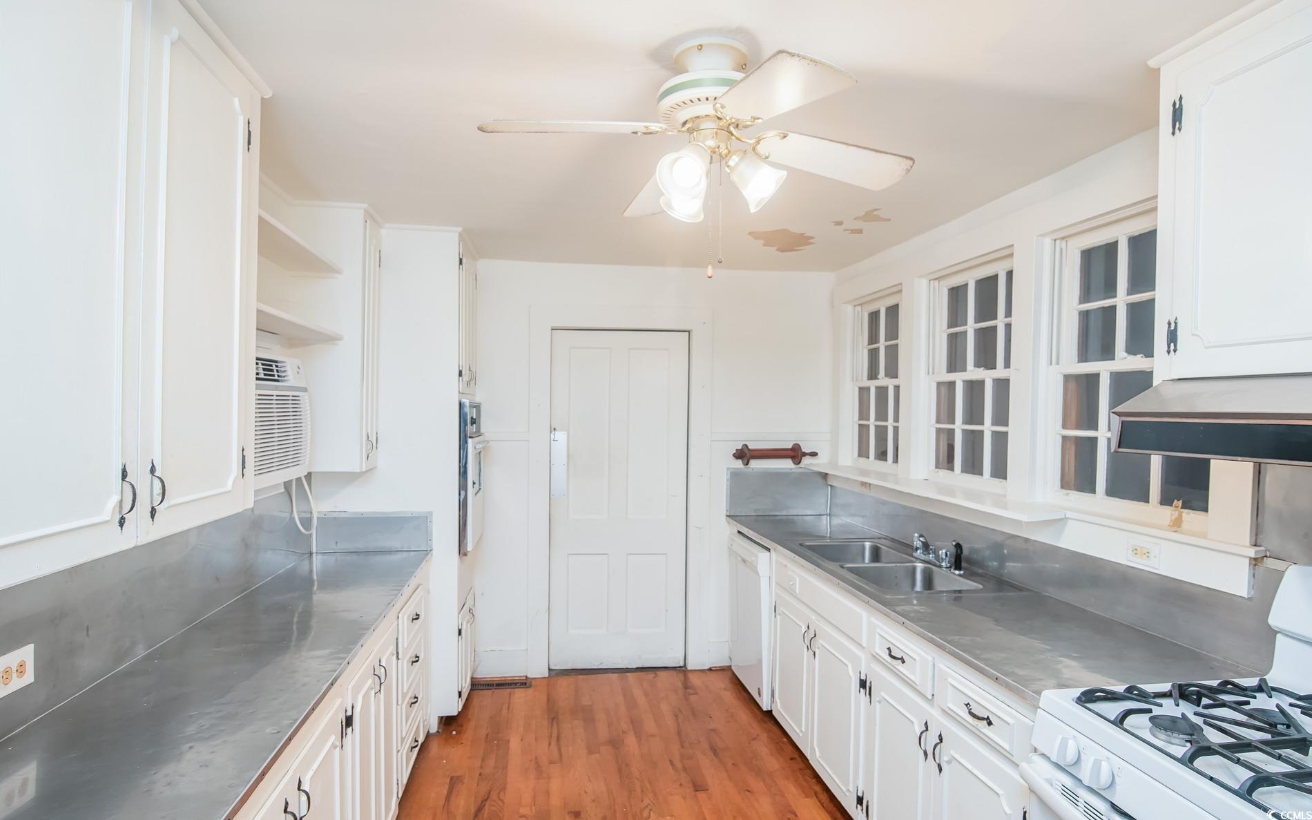 1010 Highmarket Street Georgetown, SC 29440 - Photo 15 of 32 Kitchen featuring stainless steel countertops, white appliances, open shelves, and white cabinetry