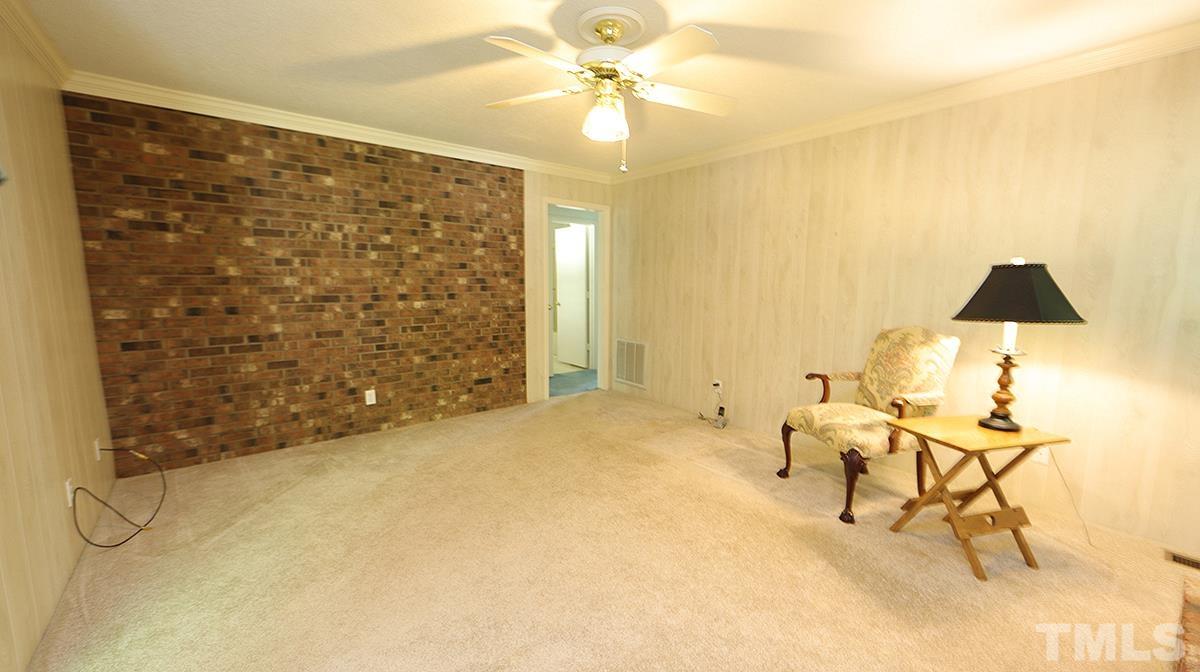 720 Torredge Road Durham, NC 27712 - Photo 11 of 17 a view of a livingroom with furniture and chandelier fan