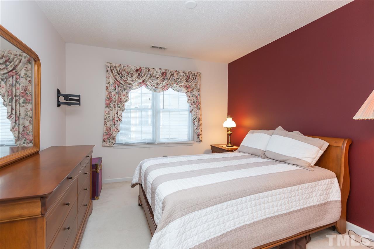 5309 Tilford Lane Raleigh, NC 27613 - Photo 22 of 26 a bedroom with a bed and a window