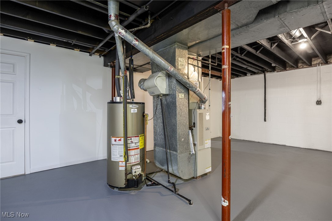 2840 Wadsworth Road Barberton, OH 44203 - Photo 24 of 32 Unfinished below grade area with water heater and heating unit