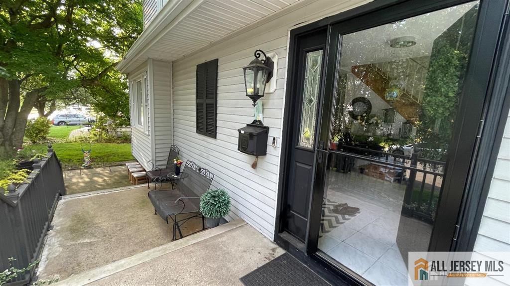 102 Gracey Street Edison, NJ 08817 - Photo 3 of 16 a porch with seating space