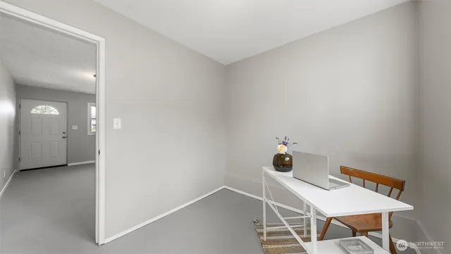 a bathroom with a granite countertop toilet a sink and a mirror