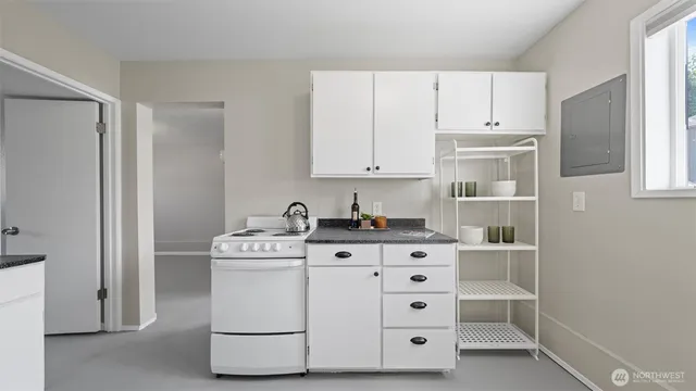a view of backyard of house with outdoor seating and covered with green space