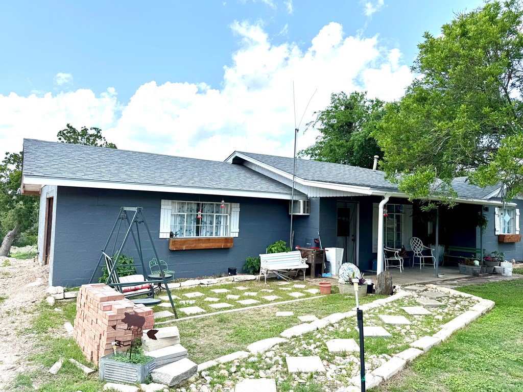 212 Way Drive Ingram, TX 78025 - Photo 3 of 22 a front view of a house with swimming pool
