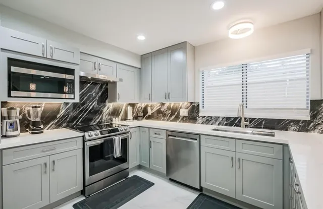 a kitchen with a stove microwave and refrigerator
