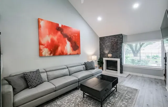 a bedroom with a bed and a couch