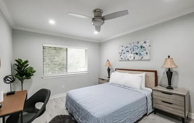 a living room with furniture a window and a chandelier