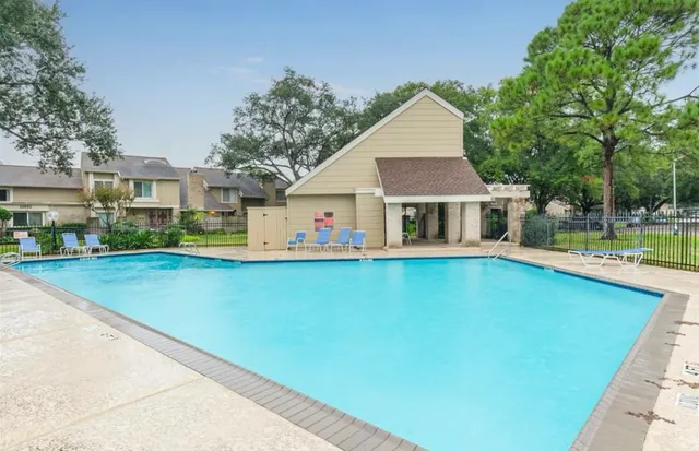 a view of house with outdoor space and sitting area