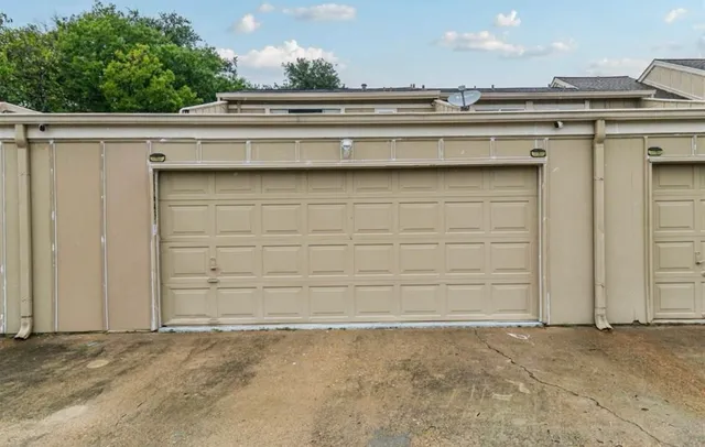 a kitchen with a sink a stove and chairs
