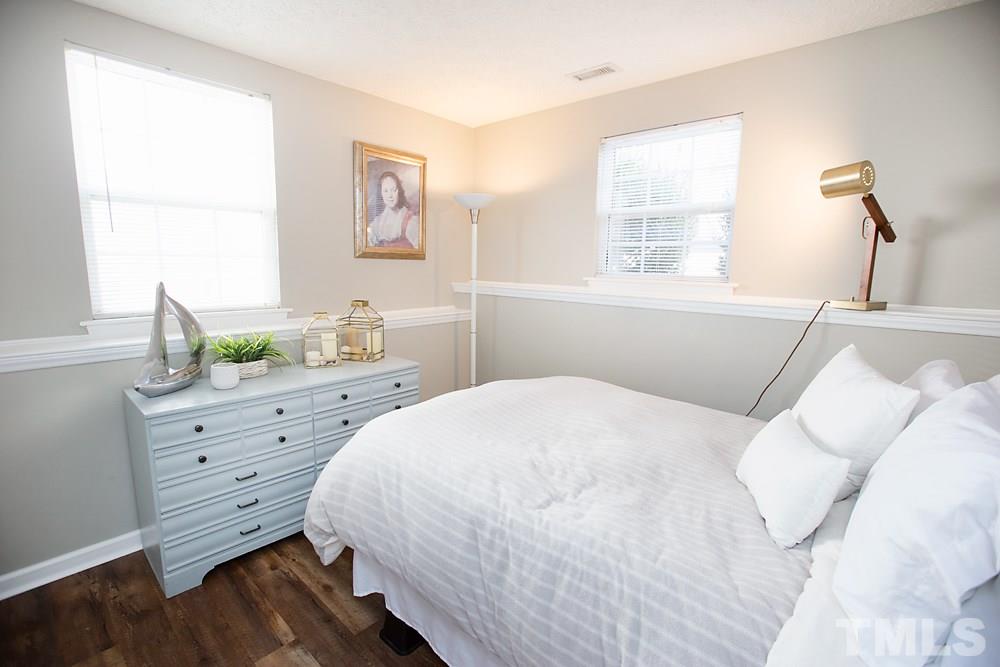 2225 Springhill Avenue Raleigh, NC 27603 - Photo 12 of 18 a bedroom with a bed and a window
