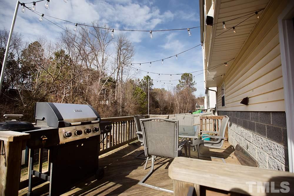 2225 Springhill Avenue Raleigh, NC 27603 - Photo 16 of 18 a roof deck with table and chairs