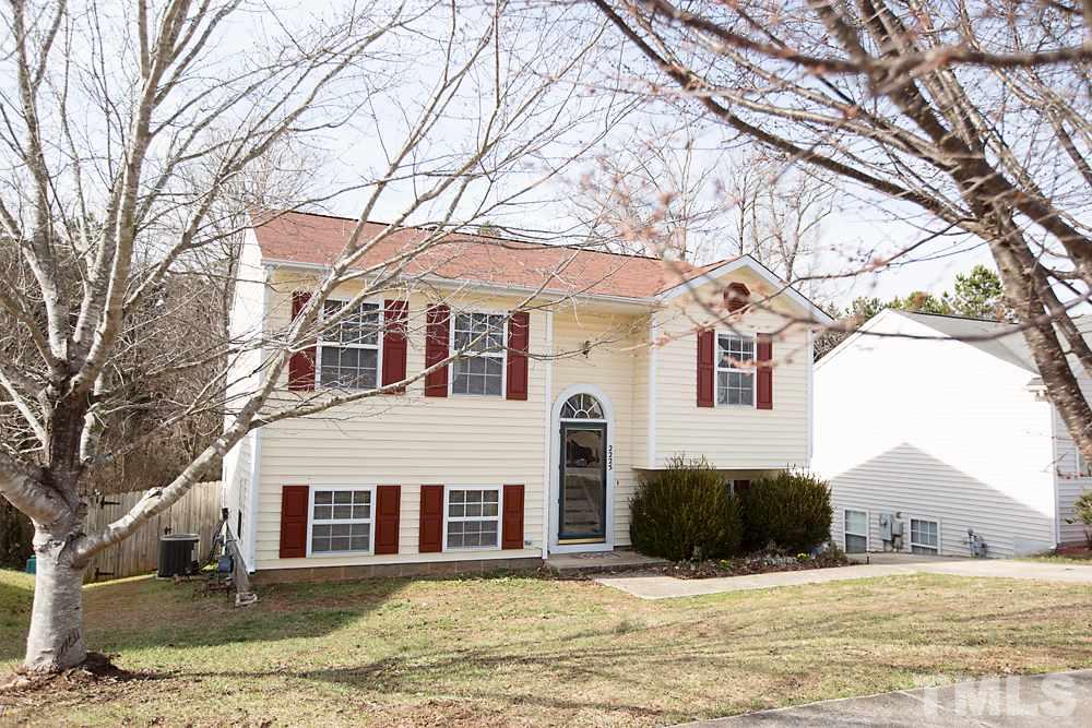 2225 Springhill Avenue Raleigh, NC 27603 - Photo 18 of 18 a view of a white house with a yard covered with snow in front of house