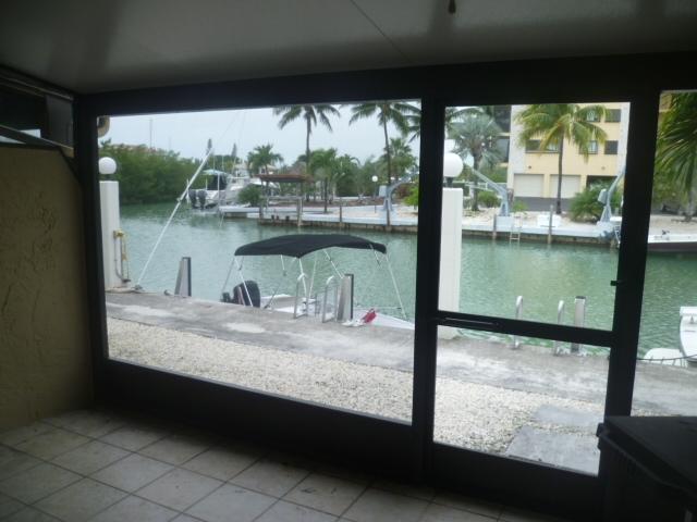 423 Sombrero Beach Road, Unit 7 Marathon, FL 33050 - Photo 2 of 12 Spacious Screen room right on the Canal