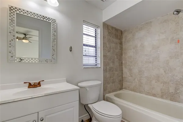 a bathroom with a sink a toilet and a bathtub