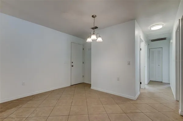 a view of a chandelier in big room and chandelier
