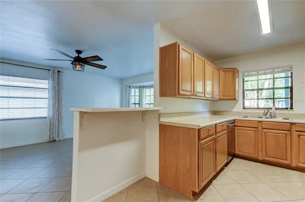 a kitchen with a stove a sink and a refrigerator