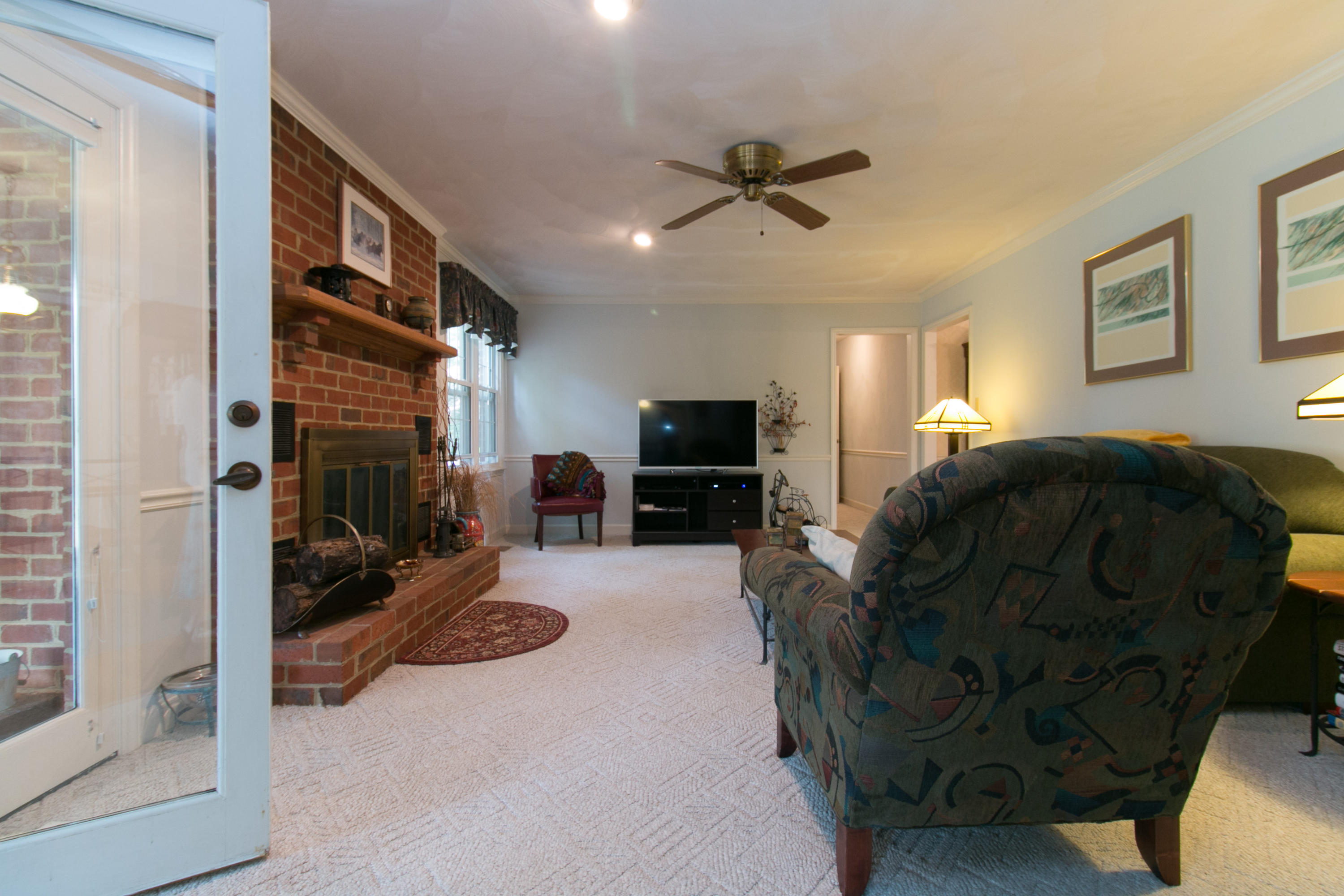457 Stonehaven Lane Blue Ridge, VA 24064 - Photo 22 of 61 a living room with furniture and a flat screen tv