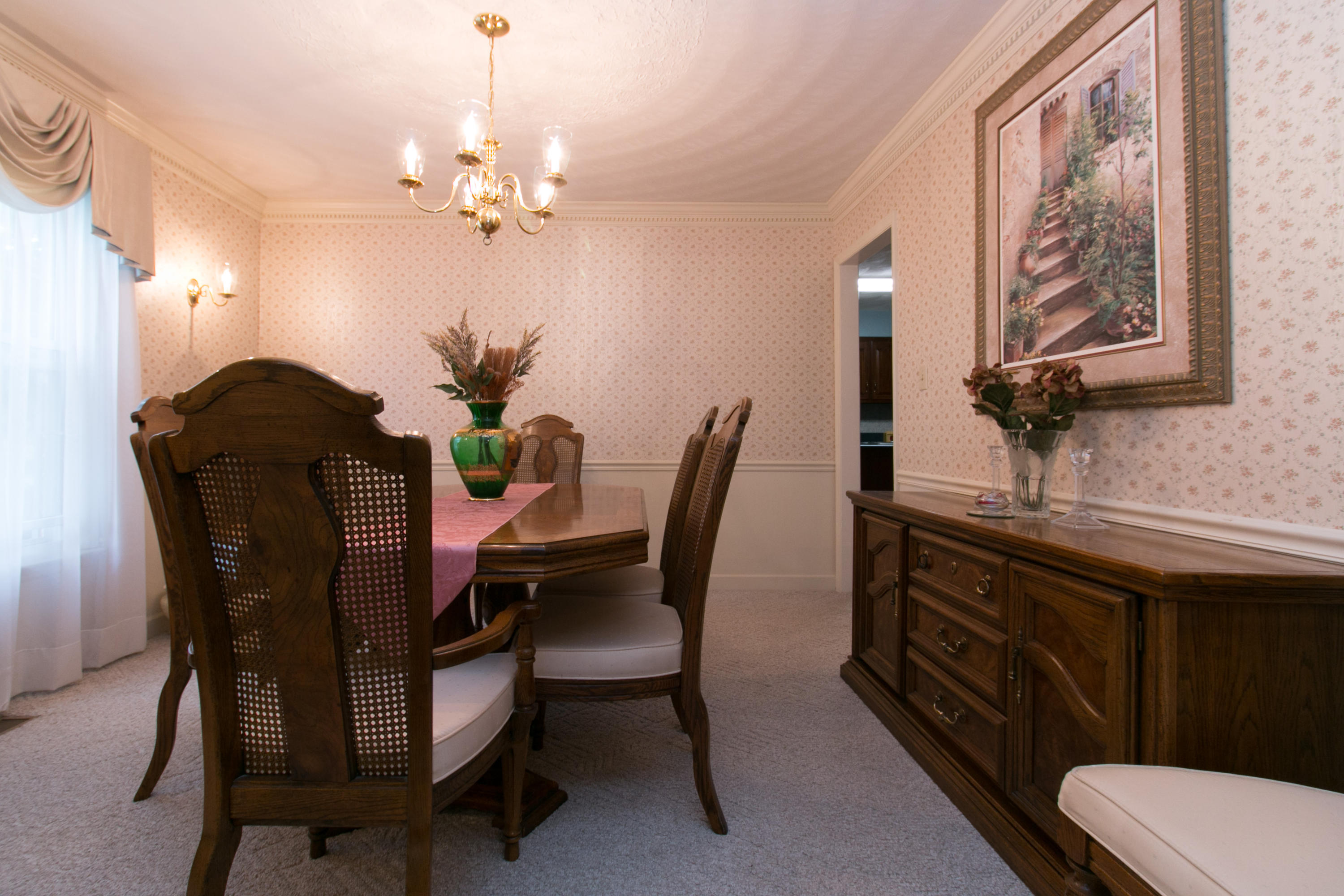 457 Stonehaven Lane Blue Ridge, VA 24064 - Photo 8 of 61 a view of a dining room with furniture and chandelier
