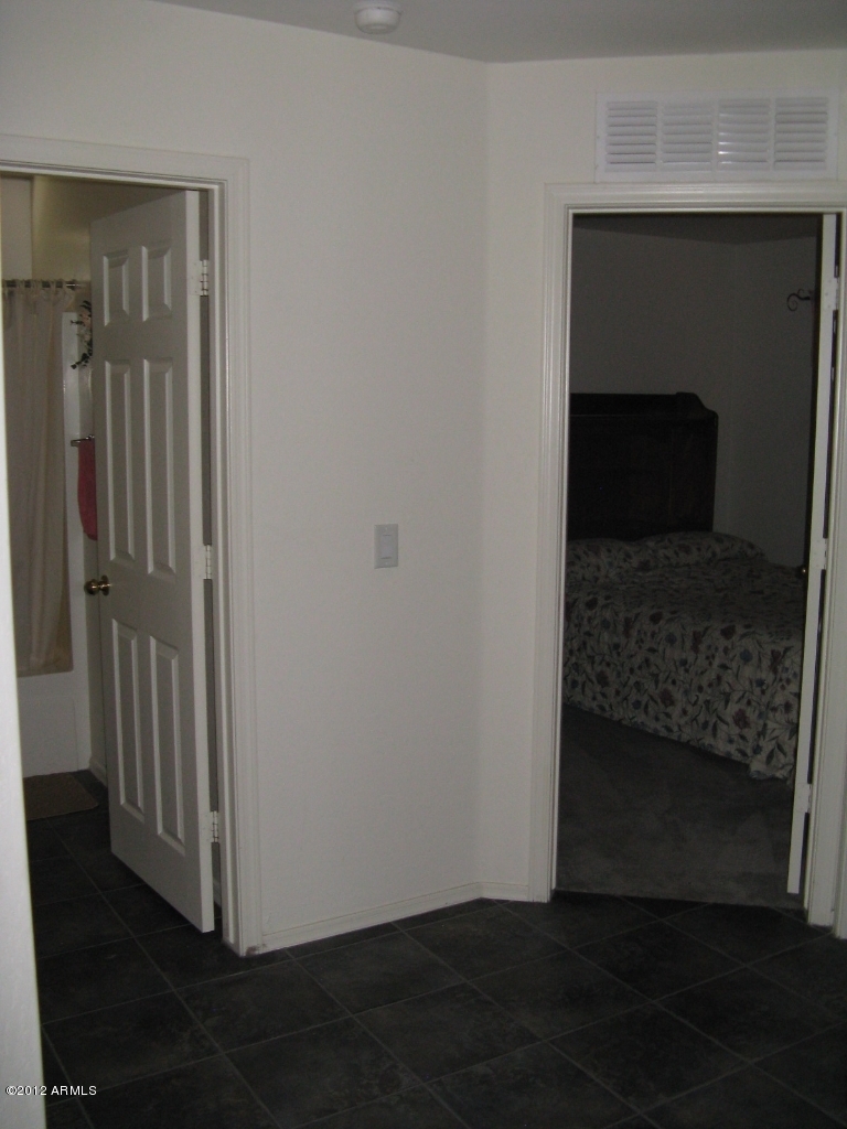 12537 West Redfield Road El Mirage, AZ 85335 - Photo 18 of 22 Hall to two bedrooms off the entry way
