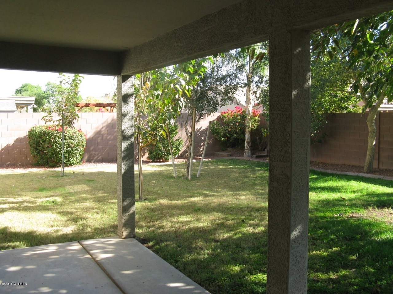 12537 West Redfield Road El Mirage, AZ 85335 - Photo 6 of 22 Rear patio looking at the yard