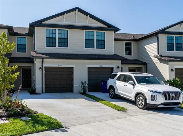 a view of a car parked in front of a house