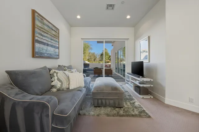 a bathroom with a double vanity sink mirror double shower and a toilet