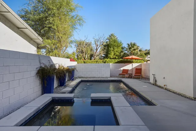 a backyard of a house with seating space