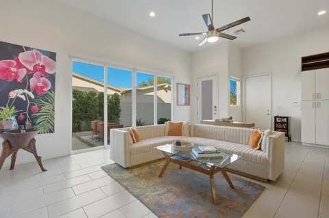 a living room with furniture and white walls
