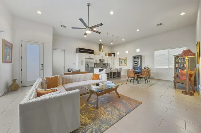 a kitchen with stainless steel appliances a sink and a refrigerator