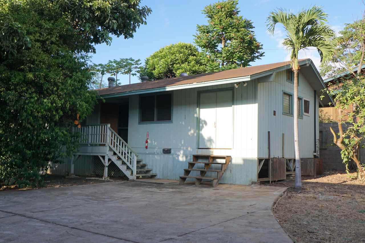 440 Mikioi Place Kihei, HI 96753 - Photo 23 of 28 a backyard of a house with table and chairs