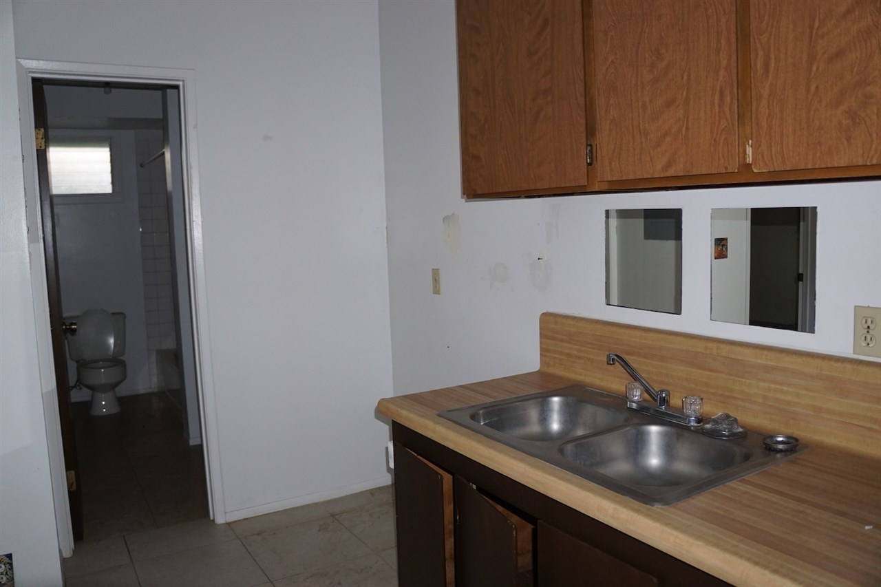 440 Mikioi Place Kihei, HI 96753 - Photo 25 of 28 a bathroom with a sink and a mirror