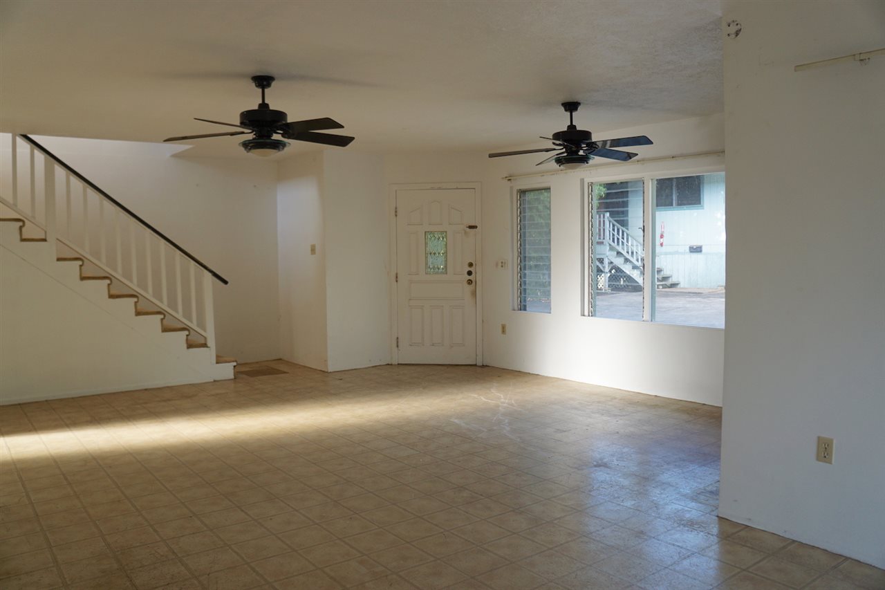 440 Mikioi Place Kihei, HI 96753 - Photo 3 of 28 an empty room with windows and fan