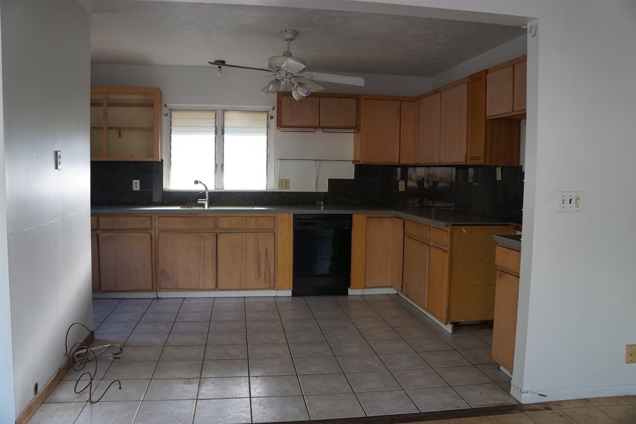 440 Mikioi Place Kihei, HI 96753 - Photo 6 of 28 a kitchen with a sink a counter space cabinets and appliances
