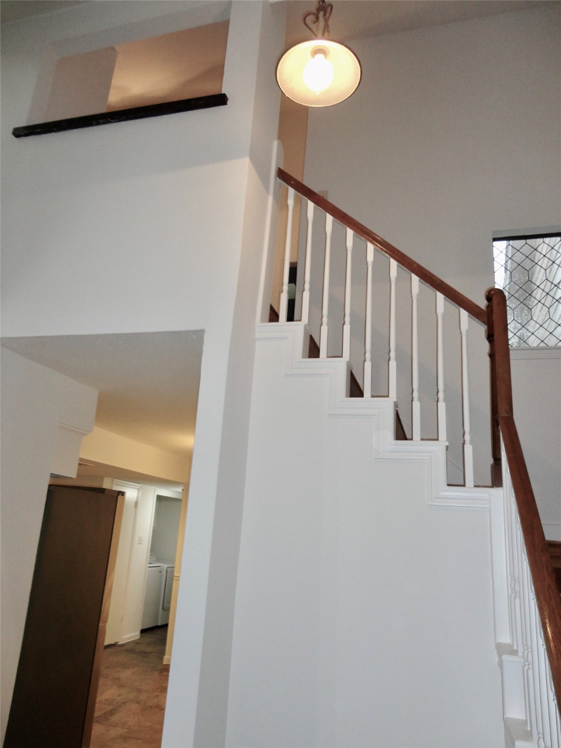 6700 Richardson Road, Unit 204 Houston, TX 77069 - Photo 11 of 39 a view of a hallway with wooden floor and staircase