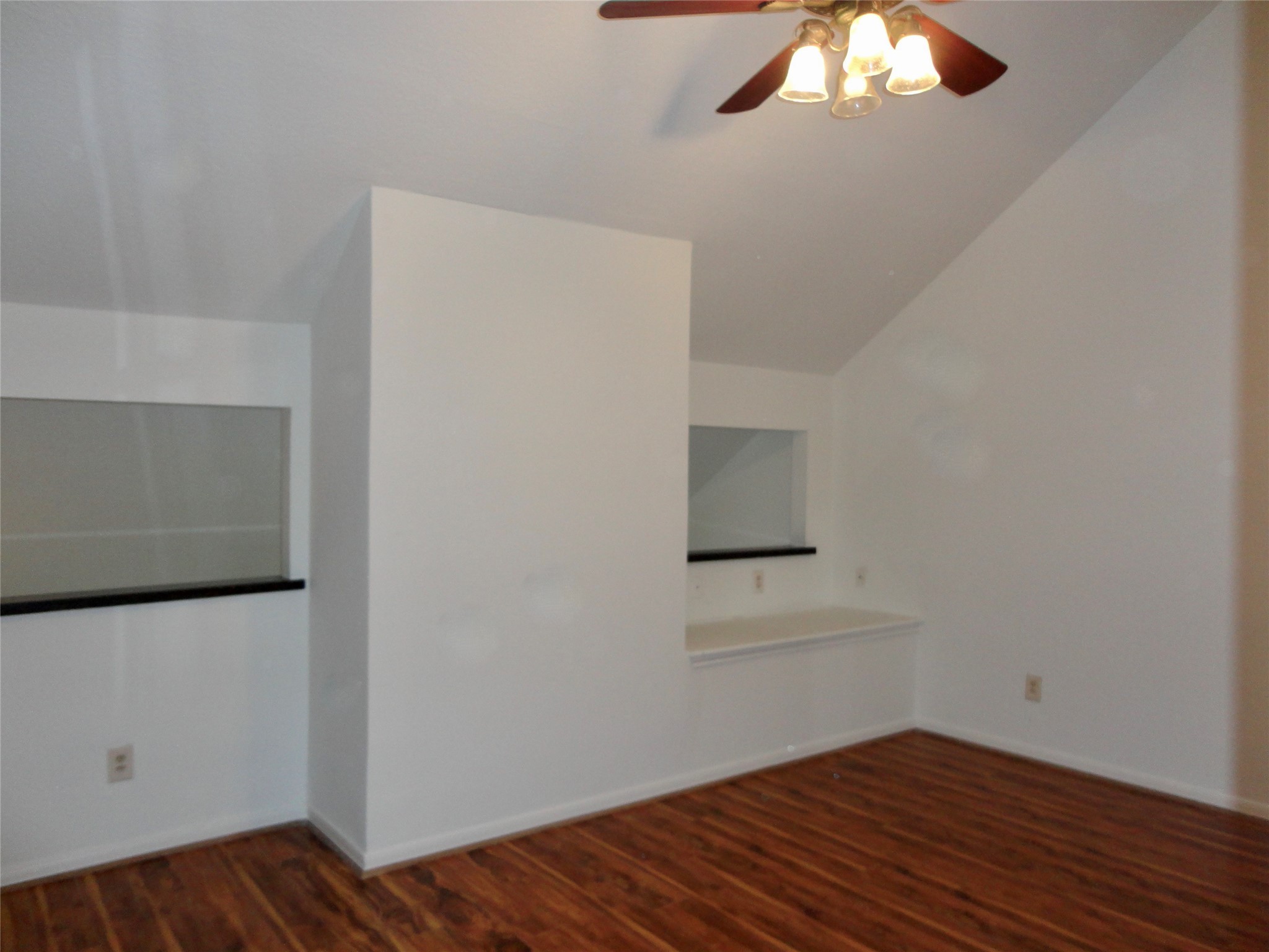 6700 Richardson Road, Unit 204 Houston, TX 77069 - Photo 18 of 39 a view of an empty room with wooden floor and a window