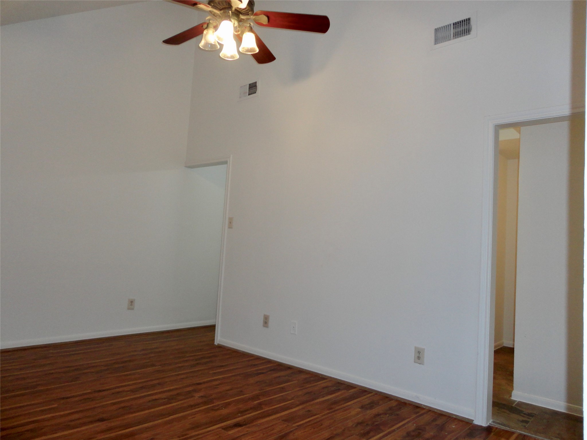 6700 Richardson Road, Unit 204 Houston, TX 77069 - Photo 19 of 39 a view of an empty room with wooden floor