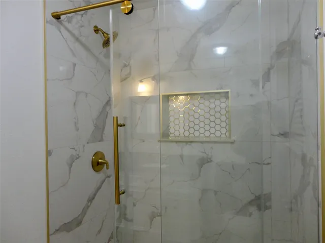 a view of an empty room and wooden floor