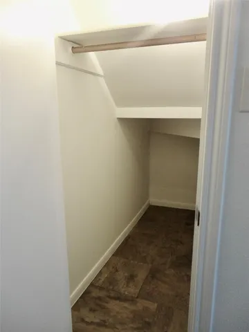 a view of a house with potted plants