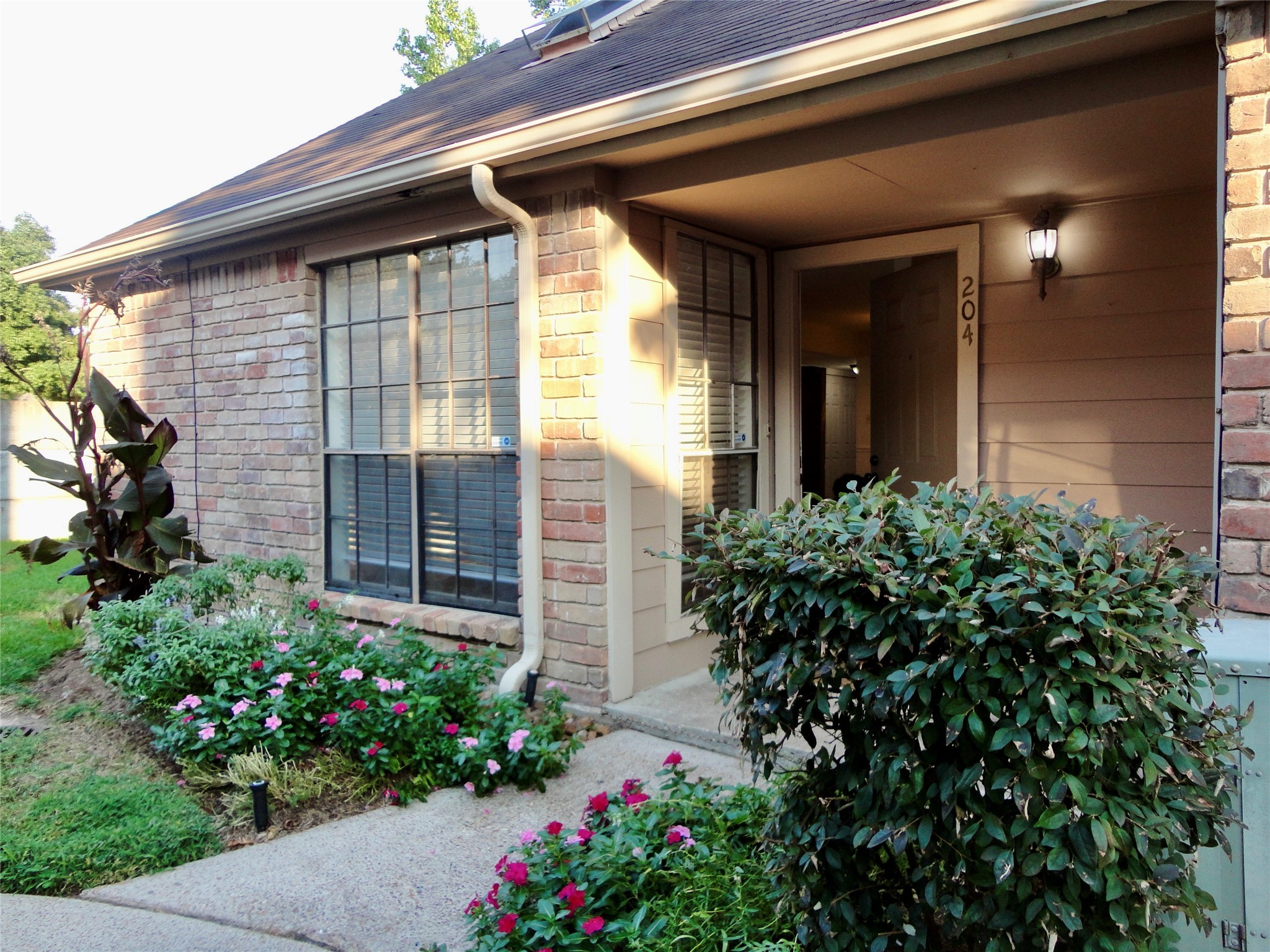 6700 Richardson Road, Unit 204 Houston, TX 77069 - Photo 38 of 39 a view of a house with potted plants