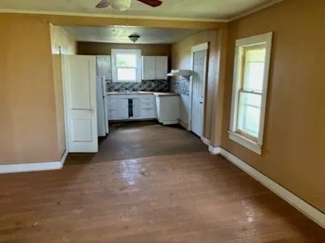 a view of a kitchen with a sink cabinets and a window