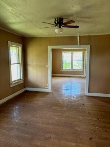 617 West Price Street Floydada, TX 79235 - Photo 8 of 12 an empty room with a window