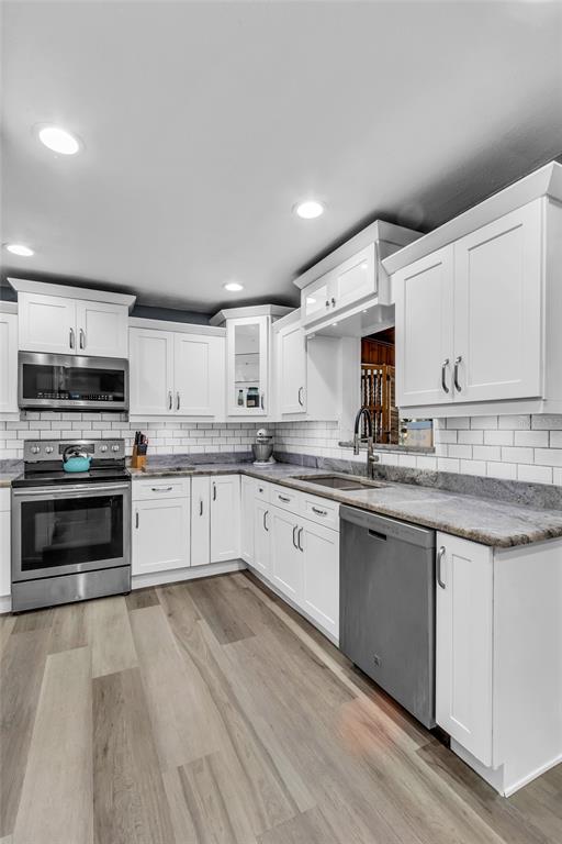 5012 West C 476 Bushnell, FL 33513 - Photo 13 of 42 a kitchen with stainless steel appliances granite countertop a stove sink and cabinets
