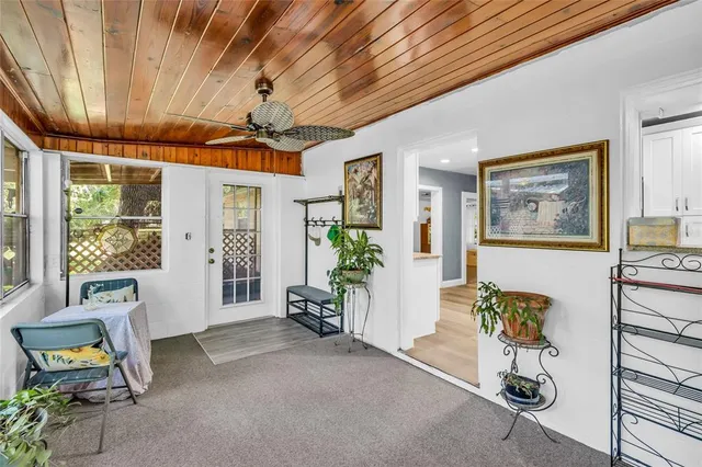 a dining room with furniture and a chandelier