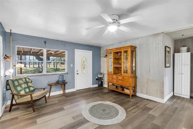 a living room with furniture and a window