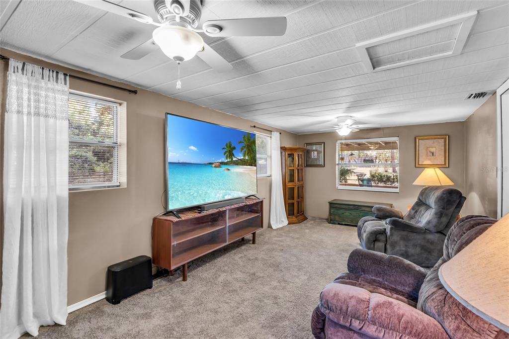 5012 West C 476 Bushnell, FL 33513 - Photo 22 of 42 a living room with furniture and a flat screen tv