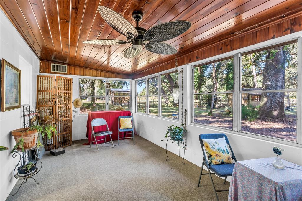 5012 West C 476 Bushnell, FL 33513 - Photo 24 of 42 a dining room with furniture and a chandelier